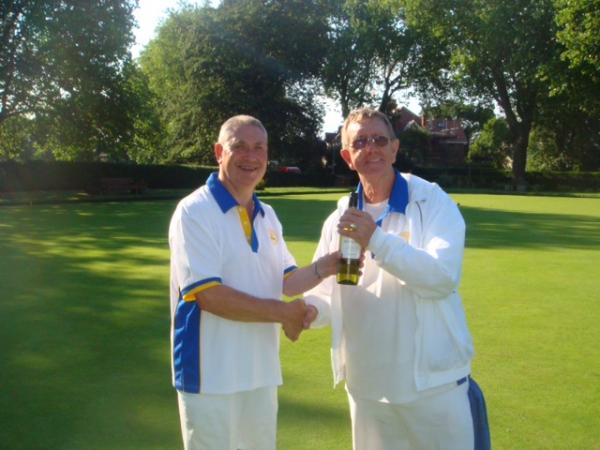 Francis Drake Bowls Club, Hilly Fields, Brockley, SE4 1QE. Dennis receiving his prize from captain Mick